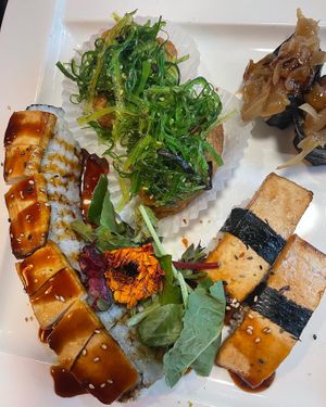 Vegan dragon roll, chewy inari, tofu nigiri, onion nigiri  at Kamakura Japanese Cuisine in Seattle