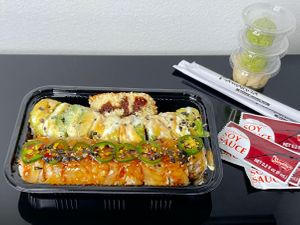 crunch inari, avocuddle roll, jalaspicy roll (takeout) at Kamakura Japanese Cuisine in Seattle