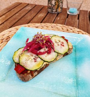 rústico bread with hummus, grilled pepper, cucumber & pickled onions at Breens Deli in Mallorca