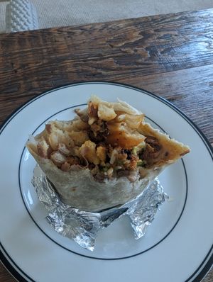 Excuse the half eaten state but this is the breakfast burrito at Taco Boys  in San Francisco