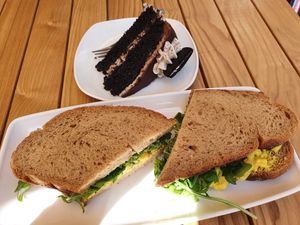 Vegan chickpea smash sandwich and vegan cookies and cream cake at Richard's Cafe in Hove