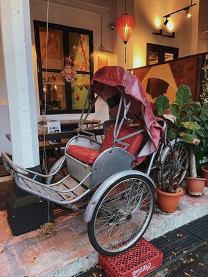 Trishaw deco outside restaurant  at Red Sparrow in Central Singapore