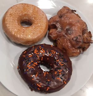 Vanilla glazed, apple fritter, and chocolate frosted with Halloween sprinkles at Glazy Susan in Worcester