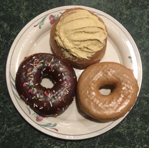 Vegan cinnamon roll with pumpkin spice buttercream frosting, chai glazed, and chocolate frosted at Glazy Susan in Worcester