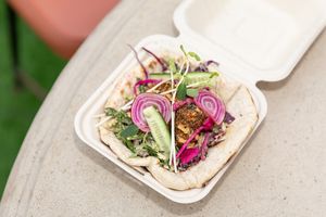 Twinkle Town Pocket -					Housemade falafel, pickles, dill slaw and Twinkle Town garlic sauce in a warm (and housemade!) pita pocket
 at Twinkle Town  in Port Douglas
