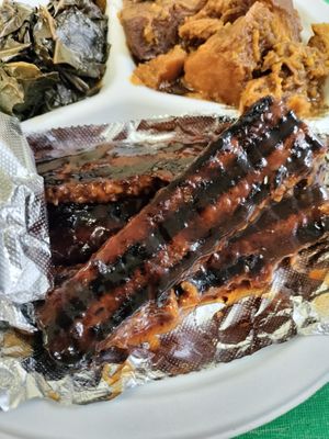 V-Rib Meal(comes with 2 side choices) pictured is Homestyle Yams, Collard Greens and a slice of CornBread(included) at Our Vegan Corner in Syracuse