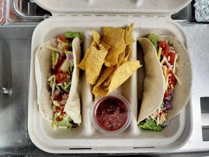 Tacos in a warm soft shell! Chosen protein in shown; Beef-Less. Order of 3 or more come with Tortilla chips and Medium spice Salsa to kick things up! at Our Vegan Corner in Syracuse