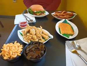 Chick'n meal and home style burger with fries. at Our Vegan Corner in Syracuse