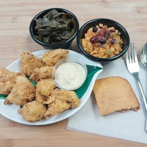 Cauliflower fried, yellow rice and beans, collard greens, cornbread slice. All homemade fresh. at Our Vegan Corner in Syracuse