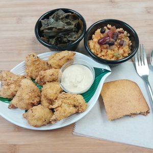 Chick'n Meal. Available in Fried Mushrooms or Cauliflower with 2 sides of choice and a free slice of cornbread. (Shown; Fried Cauliflower, Collard Greens, Yellow Rice and beans) GF at Our Vegan Corner in Syracuse