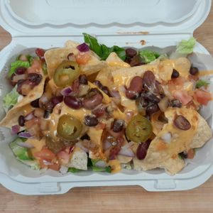 Loaded Crunch. Layers of Tortilla Chips covered in our popular melted cheese and fresh toppings. (Soy-free, Gluten-free, Dairy-free) at Our Vegan Corner in Syracuse