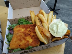 Fried cheese (very similar to real), salad, fries and tatar sauce. All in take-out box. at Vegánsky Gazda in Trencin