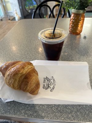 Black coffee and croissant   at Minglewood Bake Shop in Richmond