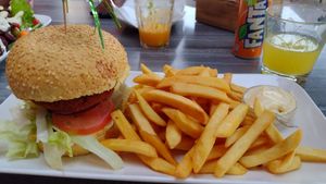 Vegan kip (chicken) burger menu with fries and drink at Vegan Food Bar in Almere