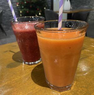 Red fruit smoothie and Strawberry mango smoothie  at Vegan Food Bar in Almere