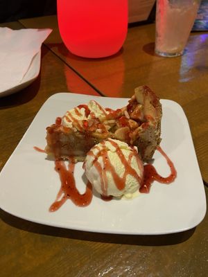 Apple pie with vanilla ice-cream and strawberry sauce: nice, but the apple pie is quite plain.  at Vegan Food Bar in Almere