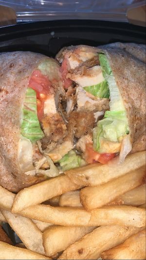 Buffalo chick’n wrap with fries! The best menu item!  at The Diner Boys in Merrick