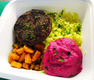 Patties with basmati rice, roasted carrots and beetroot hummus at La Línea Verde in La Linea De La Concepcion
