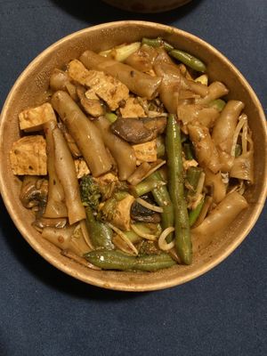 Szechuan noodles (stir fried rice noodles with veggies and tofu). Delivery via wolt  at Unnikku in Tel Aviv