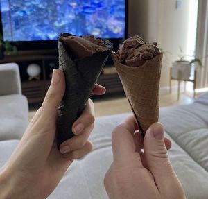 Chocolate ice cream with charcoal cone and normal cone  at Coco Lov in Tampa