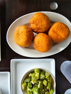 fried dumplings - DELICIOUS. but i recommend dipping it into the ital stew.  at Jamaican Breeze Sports Bar & Grill in Indianapolis