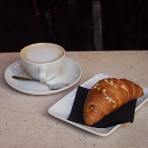 Croissant and capuccino  at Antico Caffè San Marco in Trieste