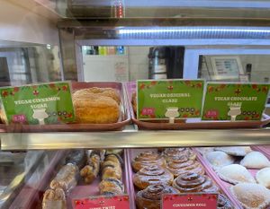 vegan donuts labeled with green signs   at Barrio Donas in San Diego