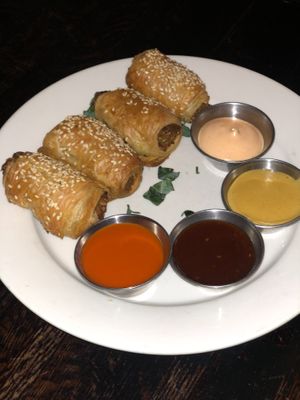 “No Pigs” in Blankets 
House made Gluten Free & Soy Free sausages wrapped in a puff pastry dough. Choice of : sriracha Mayo;Buffalo sauce or Kung Pao .  at The Organic Grill in New York City