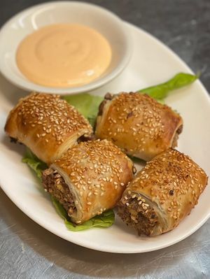 New Appetizer Alert : Not” Piggy in a blanket . Our own house made sausage wrapped in tempeh bacon and puff pastry! at The Organic Grill in New York City