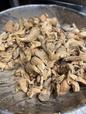 Preparing oyster mushrooms for OGICKEN Tenders  at The Organic Grill in New York City