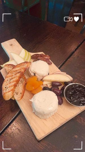 Share a charcuterie board (N)
Variations of cashew brie paired with dried apricots, dates, kalamata olives, black
cherry jam, fresh fruits, and toasted ciabatta crostini.  at The Organic Grill in New York City