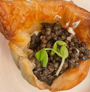 "Caviar" Rosettes (S)
Beluga lentils in puff pastry rosettes with tofu crème fraîche and fresh dill.  at The Organic Grill in New York City