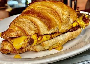 Cheesy Croissant. Served with tempeh bacon or veggie sausage   at The Organic Grill in New York City