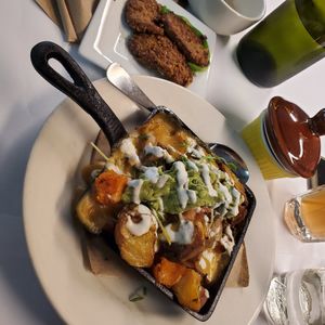 Loaded fries with house made sausage at The Organic Grill in New York City