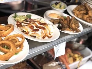 Organic Grill appetizers: Gluten Free Onion Rings , Jackfruit Enchiladas, OGicken Tenders  at The Organic Grill in New York City