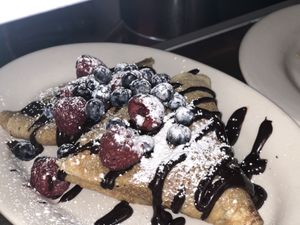New Brunch Dish : Mixed Berry Crepes . Served w cashew cream and chocolate sauce  at The Organic Grill in New York City