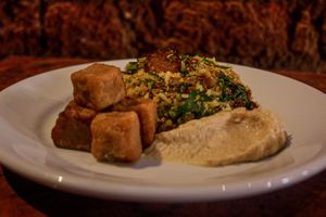 Vegan Vatapá (Bahia) with Cooked Corn Meal in cubes anda Baião (mixed traditional brazilian food) at Bandolim in Rio De Janeiro