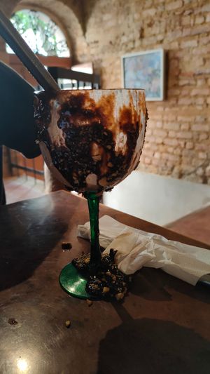 The glass is only covered with hazelnut cream on the outside. Not sure if we were supposed to lick it off, but this seemed like a sad waste of food. at Bandolim in Rio De Janeiro