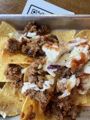Nachos. They were out of pulled pork and cheese so they put on brisket with the coleslaw and it was great.  at San Juan Smokehouse in San Juan