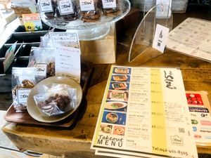 Takeout Menu and Cookies near the register at Cafe Slow in Tokyo