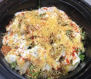 Loaded Samosa Chaat (Meal size): Vegan 🌱 Or Vegetarian. Our Loaded Samosa Chaat is served with chole (chickpea curry), samosas and our house-made yummy chutney’s  at Vittle Vibes in Leander