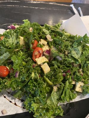 Kale salad - sub out the chicken and bacon for tofu and no feta. Very good!  at The Grilled Cheese Gallery in St Augustine