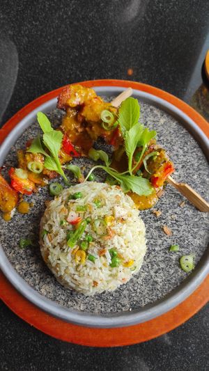 Panfried rice and vegan chicken skewers at Vegan World Peace by Loving Hut in Reykjavik