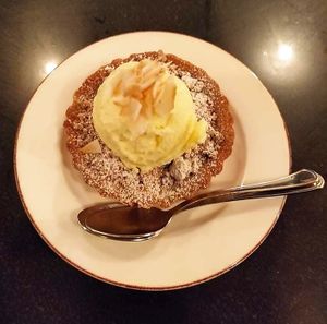 Apple cinnamon tart with vegan vanilla ice cream 😋 at Vegan World Peace by Loving Hut in Reykjavik