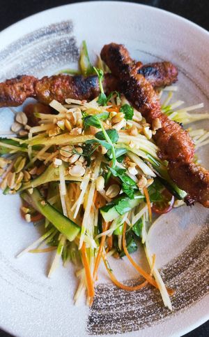 Papaya salad with "chicken" skewers at Vegan World Peace by Loving Hut in Reykjavik