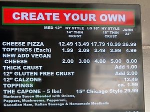 Wall menu, note vegan cheesee  at Constantly Pizza in Concord