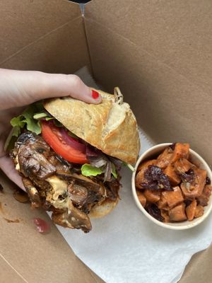 Bbq mushroom burger with a side of sweet potatoes salad. Delicious!   at The Hungry Caterpillar in Jacksonville