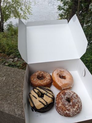 Clockwise from top left :cinnamon sugar, maple raised,gram's molasses, and peanut butter fudge at The Donut GroVe in Orono