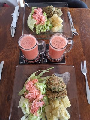 Vegan set lunch: boiled yuca, salad, lentil burgers, guava juice, and strawberries (not pictured).  at Gatorium in Quito