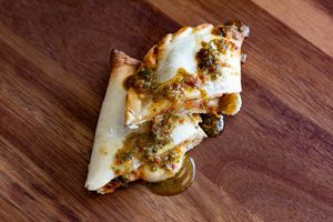 Mozzarella, tomato and basil. Tastes like a super-satisfying slice of pizza. Served with chimichurri. at Erva Brew Co. in Pasadena